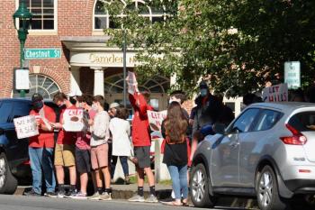 Camden Hills Regional High School students rally in downtown Camden Sept. 1, advocating to play in the state’s fall and winter schedule of competitive high school games. (Photo by Lynda Clancy)
