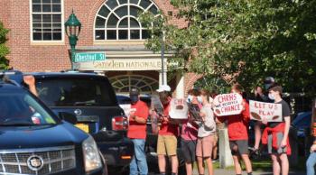 Camden Hills Regional High School students rally in downtown Camden Sept. 1, advocating to play in the state’s fall and winter schedule of competitive high school games. (Photo by Lynda Clancy)