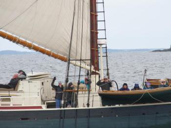 As Stephen Taber’s cannon goes off some cheer; some plug their ears. Photo by Kay Stephens