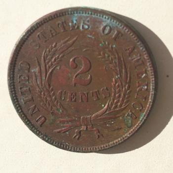 The 1868 two-cent coin that fell to the ground when lead carpenter Marc Holbrook removed the siding. Elaine Jones photo