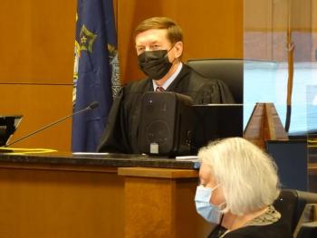 Justice Robert Murray speaks to the courtroom as he prepares to hand down his sentence. photo by Erica Thoms)