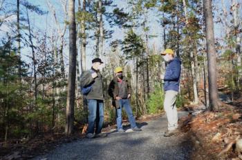 Hikers John Scholz and Tony Oppersdorff chat with Ian Stewart on the spur to the Round the Mountain Trail.