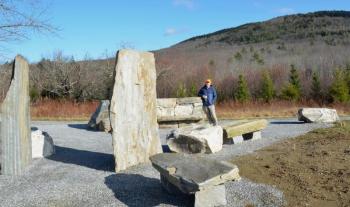 Coastal Mountains Land Trust Executive Director Ian Stewart, standing in the stone seating area built by Stonescape Masonry, at the Thorndike Brook Trailhead, on Hope Street. (Photo by Lynda Clancy)