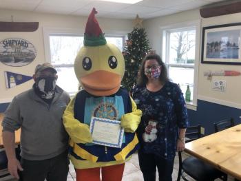 Lucky the Duck and raffle prize recipients Leni Gronros & Kim Graffam. (Photo courtesy West Bay Rotary)