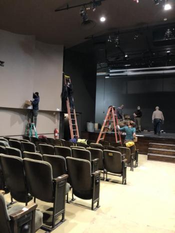 Waldo volunteers, working in masks, recently replaced hundreds of lightbulbs in the Theatres famous 1930s acoustic panels in preparation for the installation of a new house- lighting dimmer system. (Photo by Barbara Boardman)
