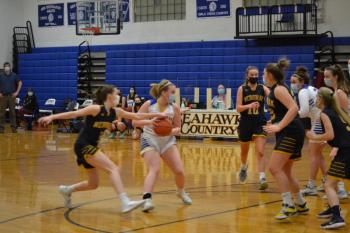 Boothbay Region point guard Kylie Brown looks for an open teammate Feb. 15 during the team’s 42-33 loss in high school girls’ action. BILL PEARSON/Boothbay Register