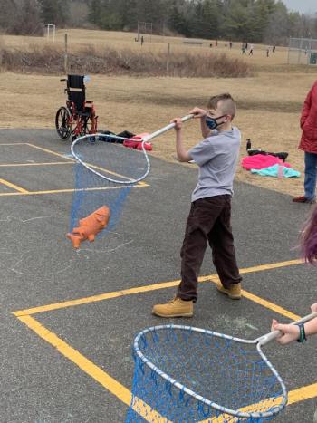 Lynell Gendron catches fish in the relay race. (Photo courtesy Thomaston Grammar School)