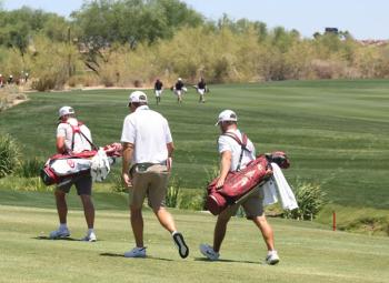 Cole Anderson, back right, walking the course next to his coach during opening day of the NCAA Division I men’s golf national championship. (Courtesy Holly S. Anderson)