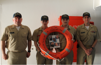 Capt. MacArthur and Capt. Cashman with the students who designed the life ring. (Photo courtesy Maine Maritime Academy)