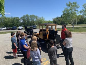 Mrs. Bassett’s third grade class and Toby Stinson, Owls Head Transportation Museum Director. (Photo courtesy Thomaston Grammar School)