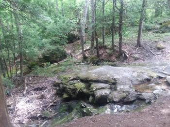 A stream running parallel to the trail becomes a waterfall. Photo by Kay Stephens