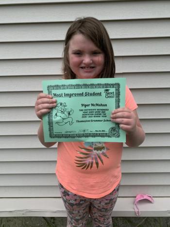 Piper McMahan receives a Sea Dog’s Most Improved Student Award. Photo courtesy Thomaston Grammar School)
