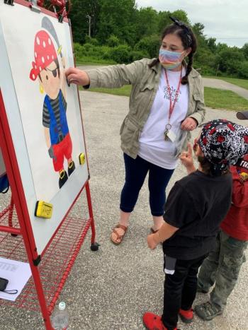Mrs. Cole leads students in “pin the patch on the pirate.” (Photo courtesy Thomaston Grammar School)