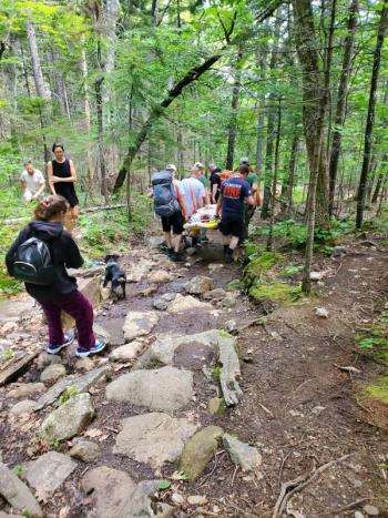 On July 23, an injured teenager was transported down Meugtincook Mountain in a Stokes basket following an ankle injury. (Photo courtesy Camden Fire Dept.)