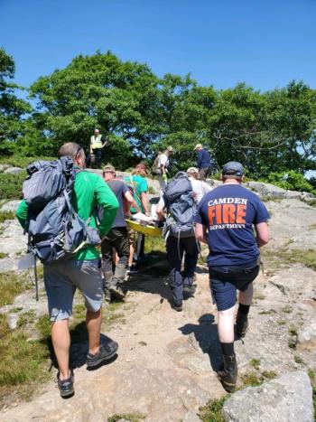 Climbing up the Mount Battie Trail July 24 with an injured hiker. (Photo courtesy Camden Fire Dept.)