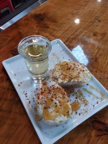 Ricotta Toast with basket ricotta made from Lakin’s Gorges cheese, with a one-ounce semi-sweet mead from Honeymaker. Photo by Kay Stephens