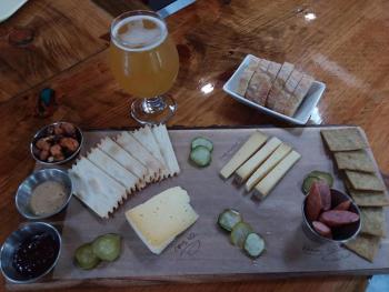 A choose-your-own chacuterie board with a Snow Wit from Bateau Brewing. Photo by Kay Stephens