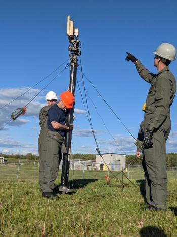 Members of the Maine Air National Guard's 265th Combat Communications Squadron install communications equipment in support of Exercise Amalgam Dart at Canadian Forces Base Cold Lake in Alberta on June 12, 2021. Photo by Maj. Brenden Westin