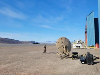 A member of the Maine Air National Guard's 265th Combat Communications Squadron supporting Exercise Amalgam Dart on June 12, 2021, at Thule Air Base in Greenland test communication equipment. Photo by Master Sgt. Joseph Durepos