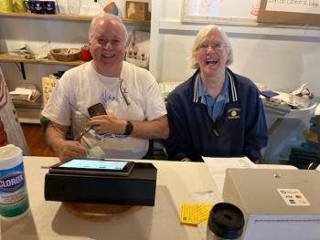 Robert Day and Jane Hardy tending the till.