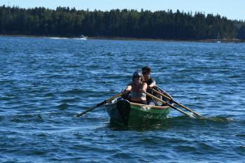 Nicolle Littrell and her son rowing. (Photo by Sam Green)