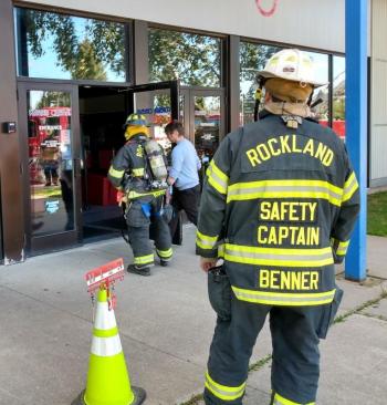 Ben Frost enters the building with a member of the Rockland Fire Department to inspect the building. (Photo by Chris Wolf)