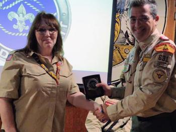 Luanne Chesley, Advancement and Recognition Chair, presented the District Award of Merit to Russell Cahn. (Courtesy photo)