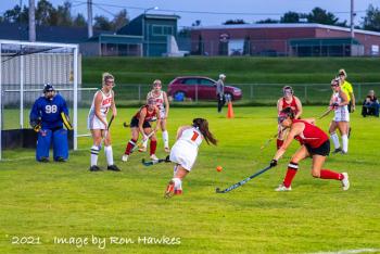 Brewer’s Allie Flagg (1) sends a shot into goal where Callie Moran gathered it and turned to blast it past Camden Hills goalie Tess Hodgkins. (Photo by Ron Hawkes)