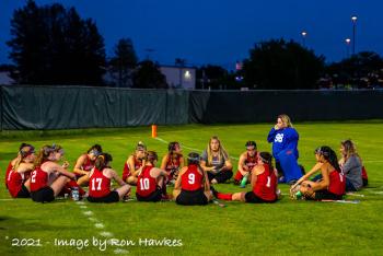 A little team meeting for Camden Hills before the start of the overtime. (Photo by Ron Hawkes)