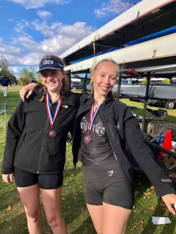 Maggie Gill, left, and Iselin Bratz victorious in their third place finish.