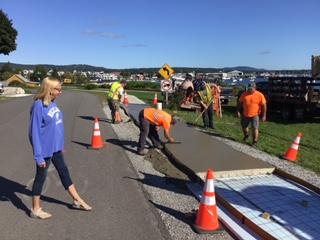 In September 2021, City Council and Harbor Trail Committee member Louise MacLellan-Ruf watches as Public Works employees build a section of stamped concrete. L to R: Josh Bodman, Damen Henderson, Ryan Fisher and Chris Donlin. (Courtesy photo)