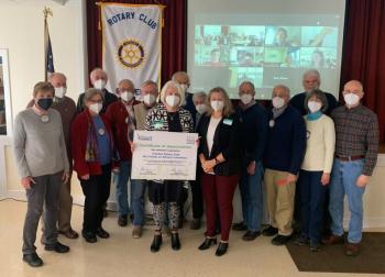 Rotarian MCH Meals on Wheels volunteers pose for a photo with MCH Meals on Wheels staff during the Dec. 7 Rotary meeting. (Back row, l-r) Rotarians Jane Monhart, Barry Timms, Joan Phaup, Chip Holmes, Bruce Cobb, Bill Griffith, Bob Baldwin, Jan Baldwin, Rich Anderson, Jim Bowditch, Jean Burleson, Steve Burleson, and Clark Doran. (Front row, l-r) MCH Executive Director Liz Schuh and MCH Program Coordinator Katie Tarbox,