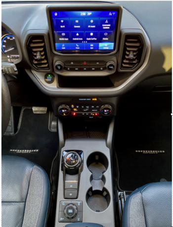 The Bronco Sport’s 8-speed automatic transmission has a rotary dial. The GOAT—Goes Over Any Terrain—selector offers Sand, Slippery, Sport, Eco or Normal drive modes; the Badlands package adds Mud/Ruts and Rock Crawl.