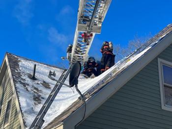 On Jan. 31, the Rockport Fire Department responded to its first chimney fire in 2022. Rockport firefighters could not reach the chimney by using the department’s regular ladders due to the home’s sloping roof design, so the Camden Fire Department provided mutual aid with its ladder truck. (Photo courtesy Rockport Fire Department)