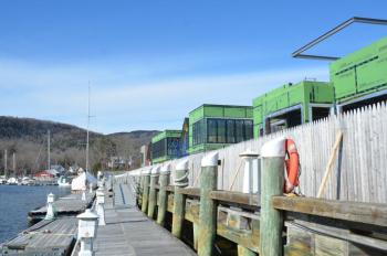 Boats will tie up at the docks that wrap around the new buildings at Lyman-Morse in Camden. The boardwalk and foundations of the new buildings are two feet higher than the old platform, raised in anticipation of increased sea levels.