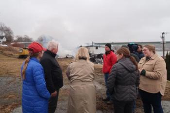 Governor Janet Mills, Penobscot McCrum CEO Jay McCrum, Belfast City Manager Erin Herbig and others outside the Penobscot McCrum potato processing facility.