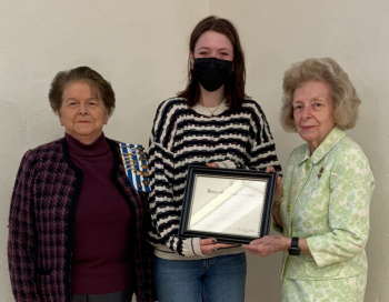 Regent Joanne Richards looks on as Magnolia Vinci, Watershed School, receives her certificate from Joyce Davies, vice-regent of Lady Knox Chapter. (Photo courtesy Lady Knox Chapter)