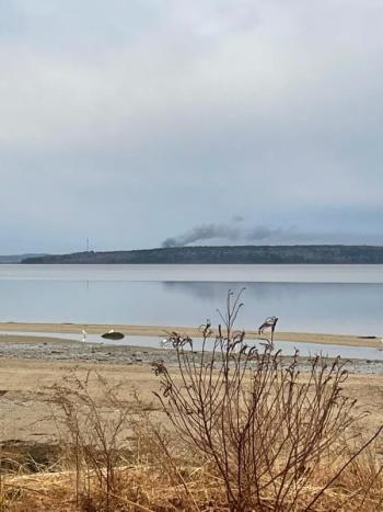 Smoke from the Penobscot McCrum fire rises over the horizon as seen from the Backshore Road in Castine. (Photo courtesy Orland Firefighter Matt Gray)