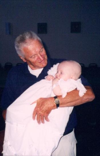 Roy Peasley at age 74 holding his great-great-niece Keariel at her baptism.