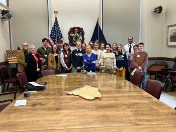 Governor Janet Mills, center, with Camden Hills Regional High School students. From left to right: Rep. Stan Zeigler, Rep. Ann Matlack, Avery Hackett, Izzy Kinney, Quinn Riordan, Lizzie Larsen-Leavins, Lincoln Pierce, Allie Gill, Governor Mills, Elsie Hildreth, Sadie Woodruff, Lucy O’Brien, Ina Wolovitz, Amelia Porter, Lea Zwecker, Margo Murphy, Rep Bill Pluecker, and Hadrian Ward.