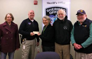 The Game Loft’s Patricia and Ray Estabrook (third and fourth from left), accept a $450 food program contribution from Belfast Rotary’s Syrena Gatetwood, Waldo County Chief Deputy Sheriff Jason Trundy, and Rotary president John Golden (right). (Photo courtesy Phil Carthage, Belfast Rotary Club)