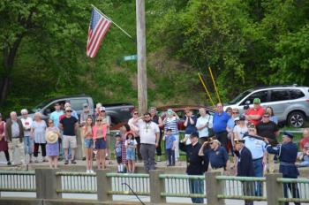 On the Goose River Bridge, the parade halted, and the Color Guard tossed a wreath into Rockport Harbor to honor those who sacrificed their lives for their country, Rev. Dave Franclemont, District 6 Chaplain, delivered an invocation, and a rifle volley was sent out to sea.