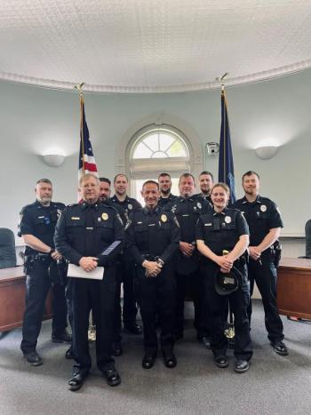 Pictured: Chief Robert Cormier, center, and members of the Belfast Police Department, including Deputy Chief Dean Jackson, Sergeant Matthew Cook, Sergeant Lewis Dyer, Sergeant Daniel Thompson, School Resource Officer Rick Smith, Officer Megan Tribuzio, Officer Jonathan Guba, Officer Jeremy Bell, and Officer Andrew Chapman. (Photo courtesy Belfast Communications Assistant Mackenzie Barnhart)