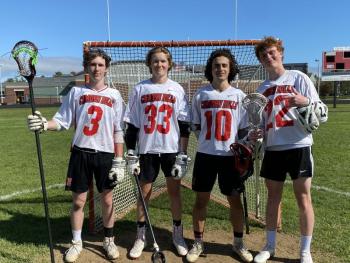 The four captains of the Camden Hills boys lacrosse team are, from left: Rory Carlson, Jackson Fitch, Willy Doehla and Owen Cooper. (Photo by Victoria Marshall.)