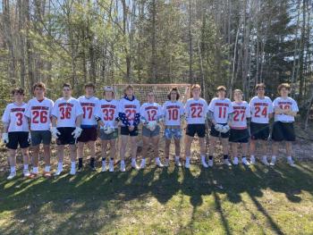 Members of the Camden Hills boys lacrosse team are, from left, Rory Carlson, Eben Weislogel, Christopher Cammelieri, Logan Odone, Owen Cooper, Eben Fagonde, Vanya Perevalov, Jackson Fitch, Willy Doehla, Jakob Johnson, Oliver Haynes, Elias Libby and Camden Powell. (Photo by Victoria Marshall.)
