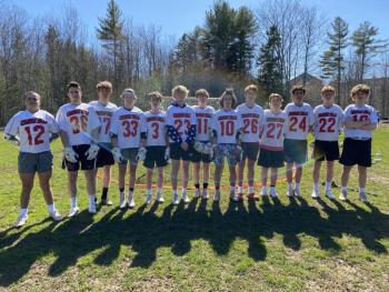 Members of the Camden Hills boys lacrosse team are, from left, Vanya Perevalov, Christopher Cammelieri, Logan Odone, Owen Cooper, Rory Carlson, Eben Fagonde, Jakob Johnson, Jackson Fitch, Eben Weislogel, Oliver Haynes, Elias Libby, Willy Doehla and Camden Powell. (Photo by Victoria Marshall.)