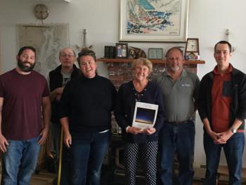 At the Lincolnville Town Report dedication surprise: Selectman Jordan Barnett-Parker, Selectman Mike Ray, Selectman Ladleah Dunn, Lee Cronin, Selectman Keryn Laite Jr., and Selectman Joshua Gerritsen. (Photo courtesy Lincolnville Town Administrator David Kinney)