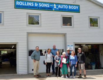 Honoring Scott Rollins at Rollins and Sons Autobody in West Rockport, June 2: Rockport Town Manager Jon Duke, Select Board members Denise Munger, Mark Kelley and Michelle Hannan, Sandra Rollins, with Greg, Trina and Levi Rollins. (Photo by Lynda Clancy)