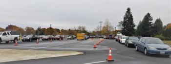 Cars line up waiting their turn in the slow moving line at Oceanside High School during a food distribution day during the pandemic lockdown. (Photo by Candice Richards).