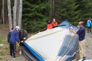 Team Katmai works together to put up tents. Photo Credit: Mike McGuire